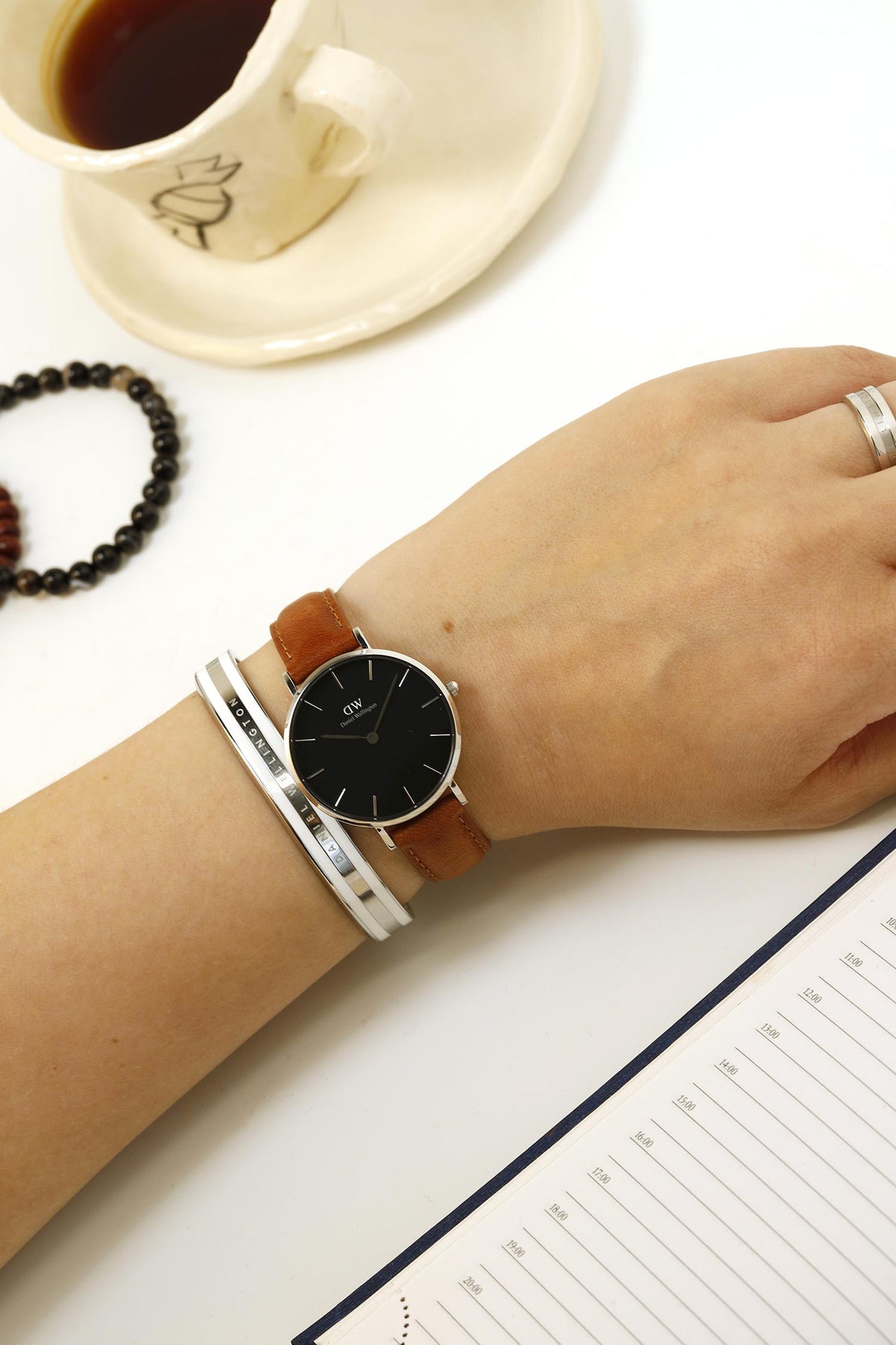 Daniel Wellington Petite Sterling Black Dial Brown Leather Strap Watch For Women - DW00100178